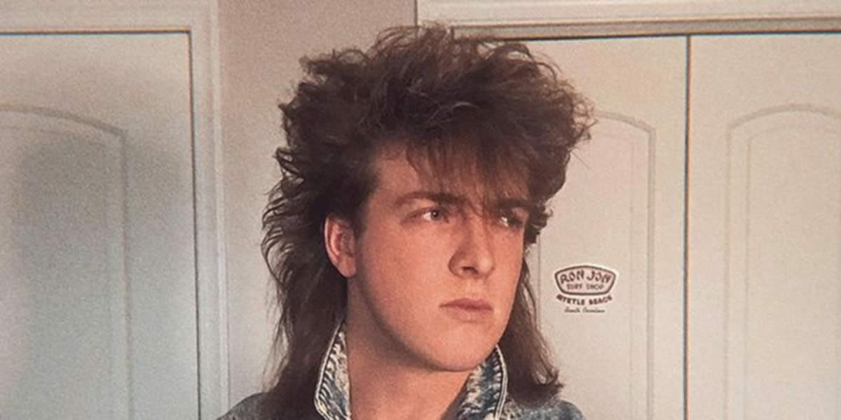 Theron Johnson with a mullet in the 80s